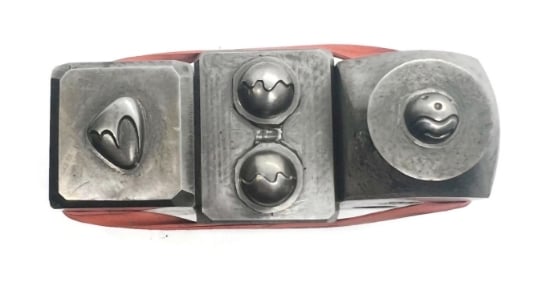 Picture of Impression Die Melting Beads and a Smile