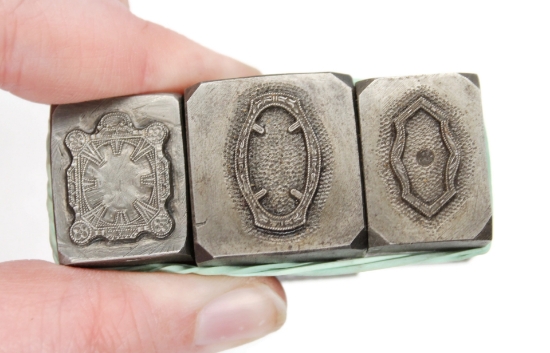 Picture of **chipped** Impression Die Thin Ornate Bezels Shot Plate