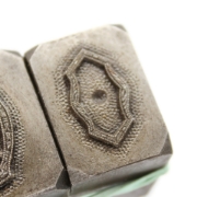 Picture of **chipped** Impression Die Thin Ornate Bezels Shot Plate