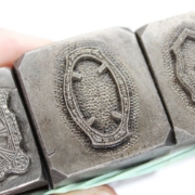 Picture of **chipped** Impression Die Thin Ornate Bezels Shot Plate