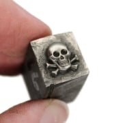 Picture of Impression Die Tiny Skull & Crossbones with Settings